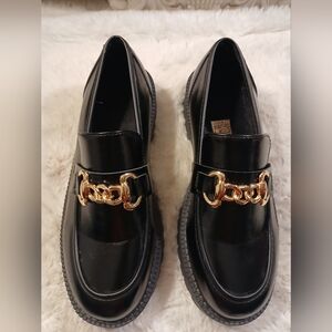 Sleek Black Loafers with Gold Chain Accent